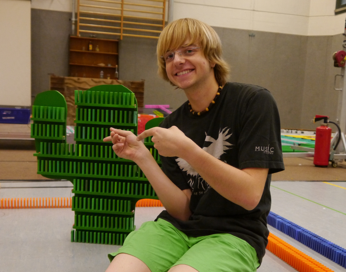 A photo of me at CDT 2013, where I participated in setting up 285 000 dominoes covering visuals on 'The Wild West'.